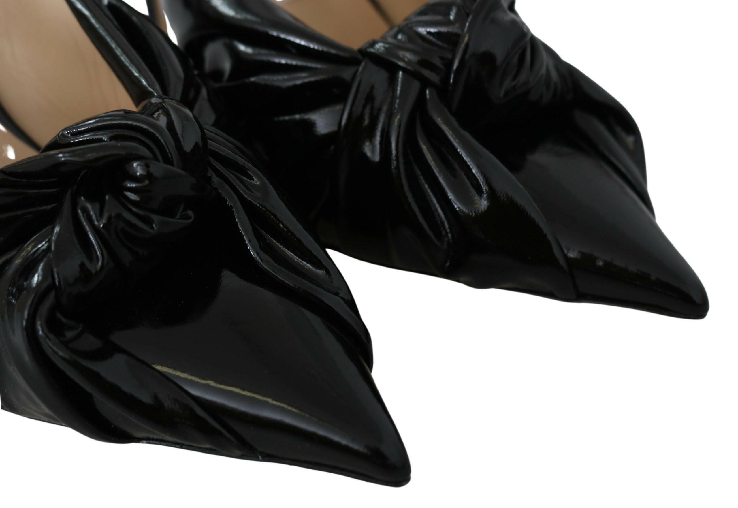 Jimmy Choo Elegant Black Leather Pointed Toe Pumps.