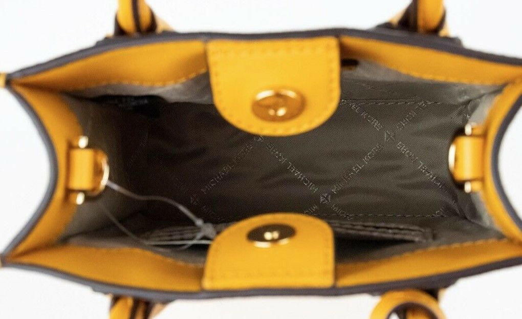 Michael Kors Mercer XS Honeycomb Gold Signature PVC North South Shopper Crossbody Bag.