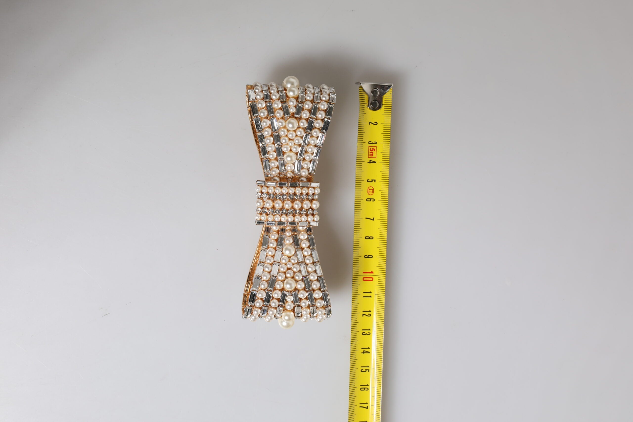 Dolce & Gabbana Gold Tone Brass Bow Crystal FauxPearl Embellished Brooch Dolce & Gabbana