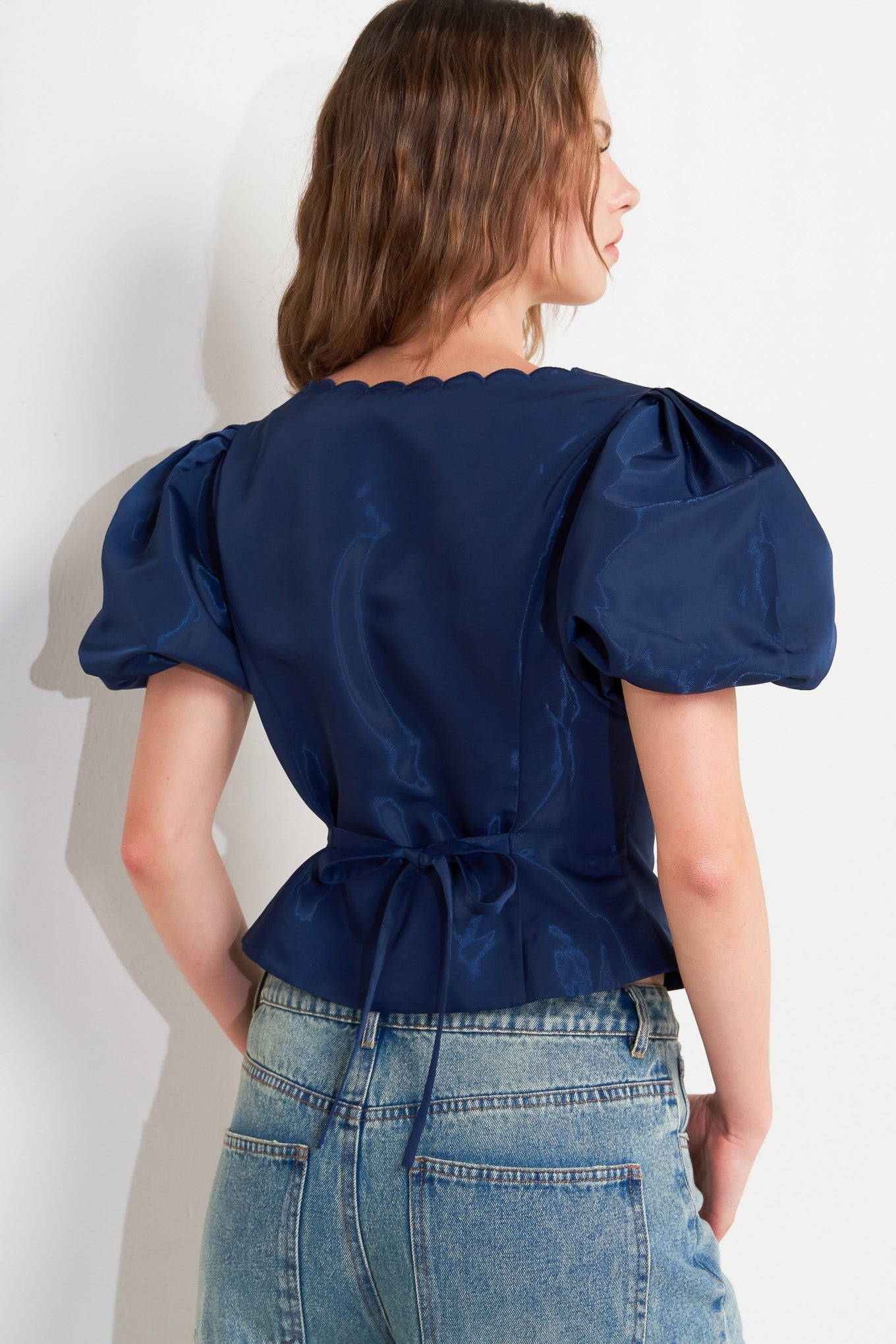 TOP TEJIDO CON BESO DE VIENTO