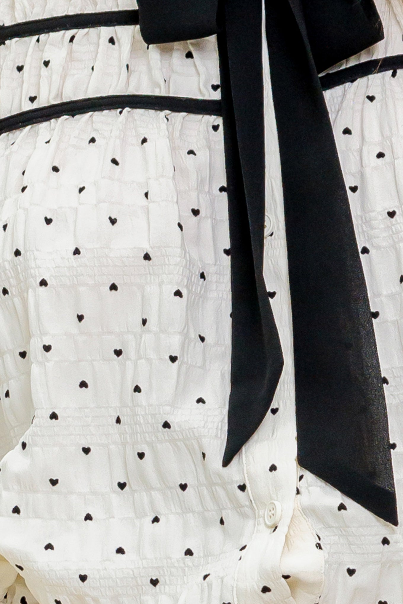 TOP TEJIDO MARFIL CON PESTAÑA ROMÁNTICA